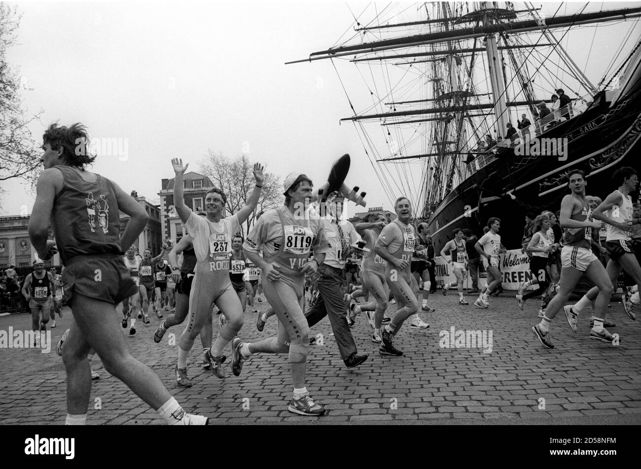 Runners passing Cutty Sark in the 1989 London Marathon, UK. Stock Photo
