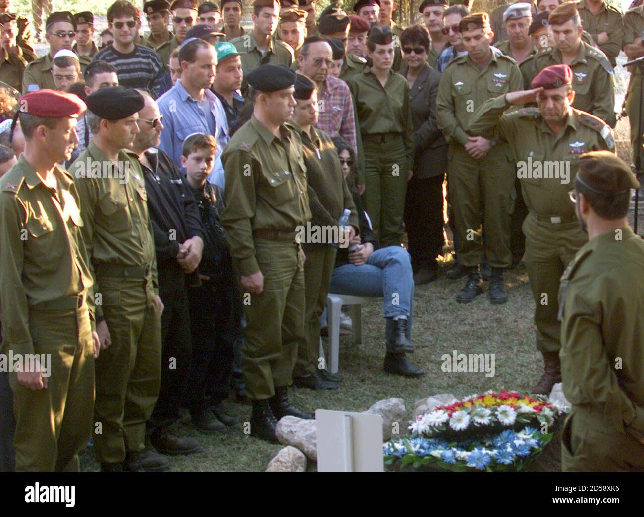 Israeli chief Shaul Mofaz salutes the fresh grave of Brigadier-General Erez Gerstein during a heroes funeral attended by thousands of mourners including senior army officers and politicians March 2. Gerstein, one of Israel's senior commander in its self-declared South Lebanon security zone, was killed alongside two soldiers and a civilian radio reporter when their convoy was attacked by pro-Iranian Hizbollah guerrillas in South Lebanon two days ago. DPS/WS Stock Photo