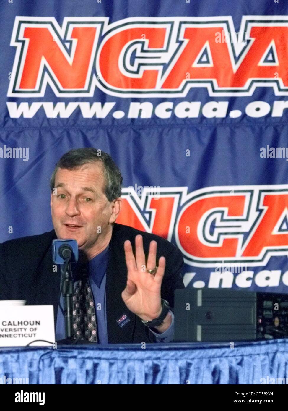 University of Connecticut Huskies head coach Jim Calhoun holds up four  fingers in a postgame press conference after his team beat the Gonzaga  University Bulldogs 67-62 in the NCAA West Regional Final