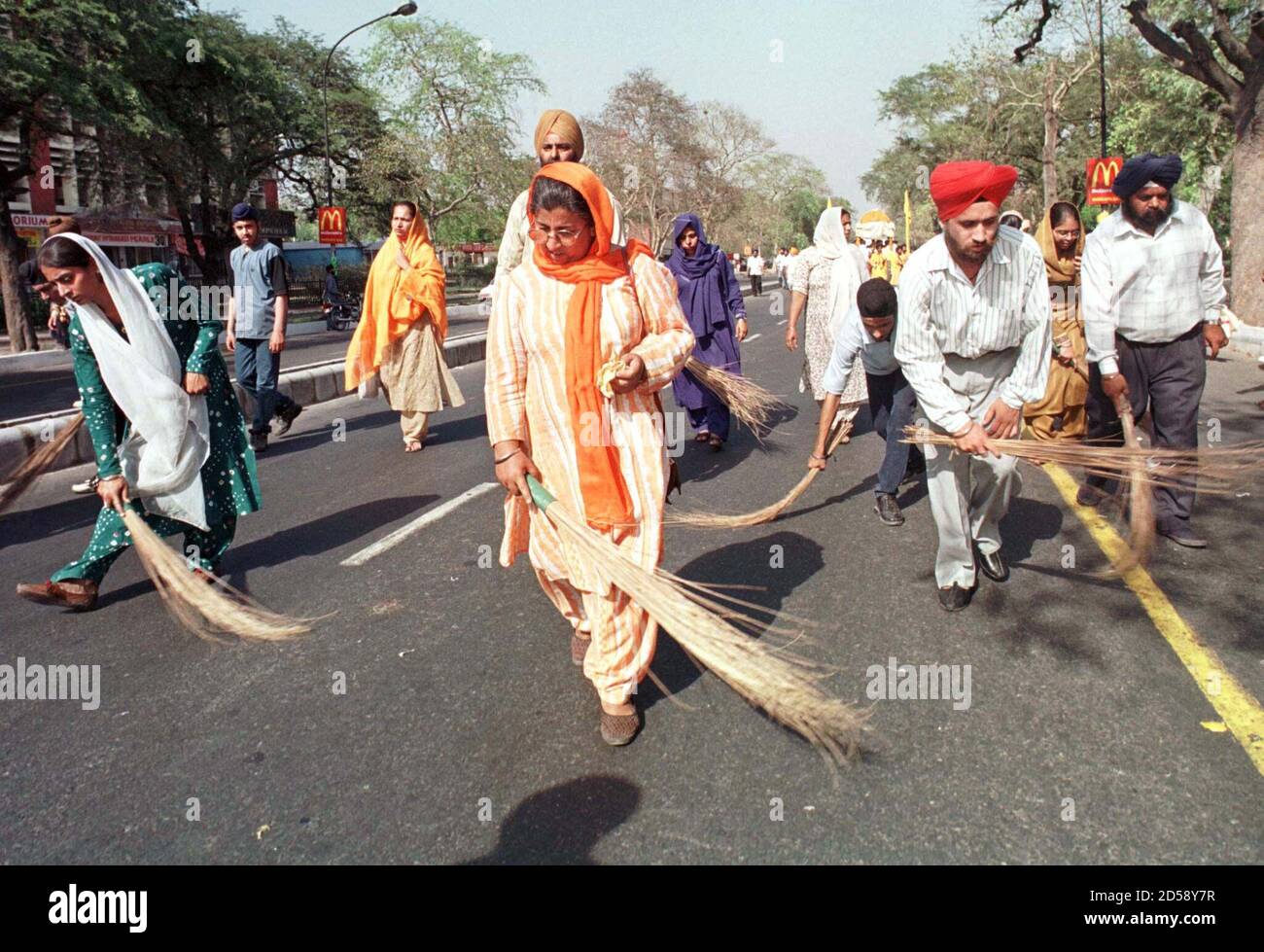 Sikh Devotees Clean A Road Ahead Of A Religious Procession During The Ten Day Celebrations Of The 300th Anniversary Of The Founding Of The Sikhism S Influential Khalsa Order In New Delhi April 10 Sikh Devotees Clean A Road Ahead Of A Religious Procession During The Ten Day Celebrations Of The 300th Anniversary Of The Founding Of The Sikhism S Influential Khalsa Order In New Delhi April 10