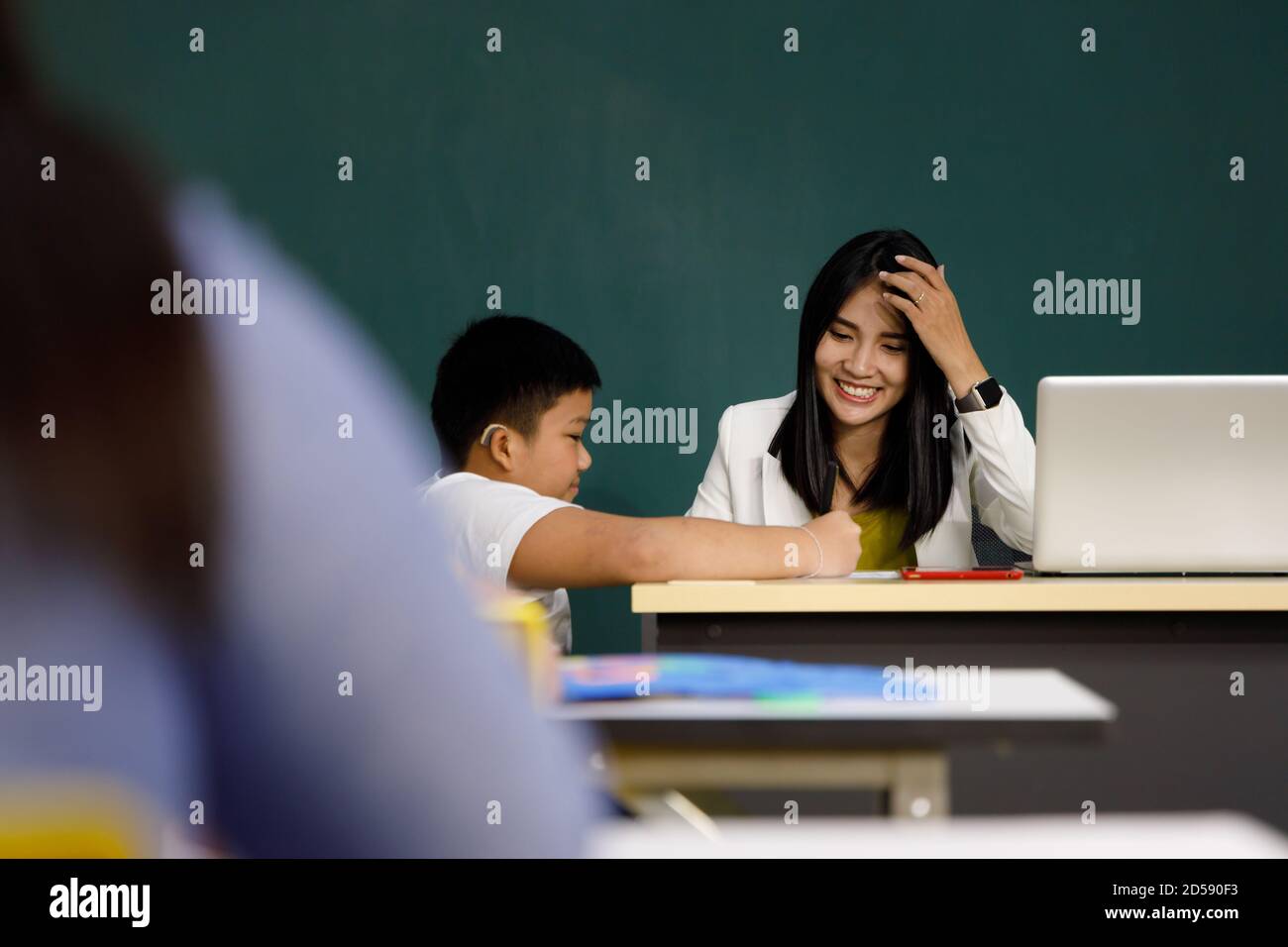Asian student and while teacher hi-res stock photography and images - Alamy