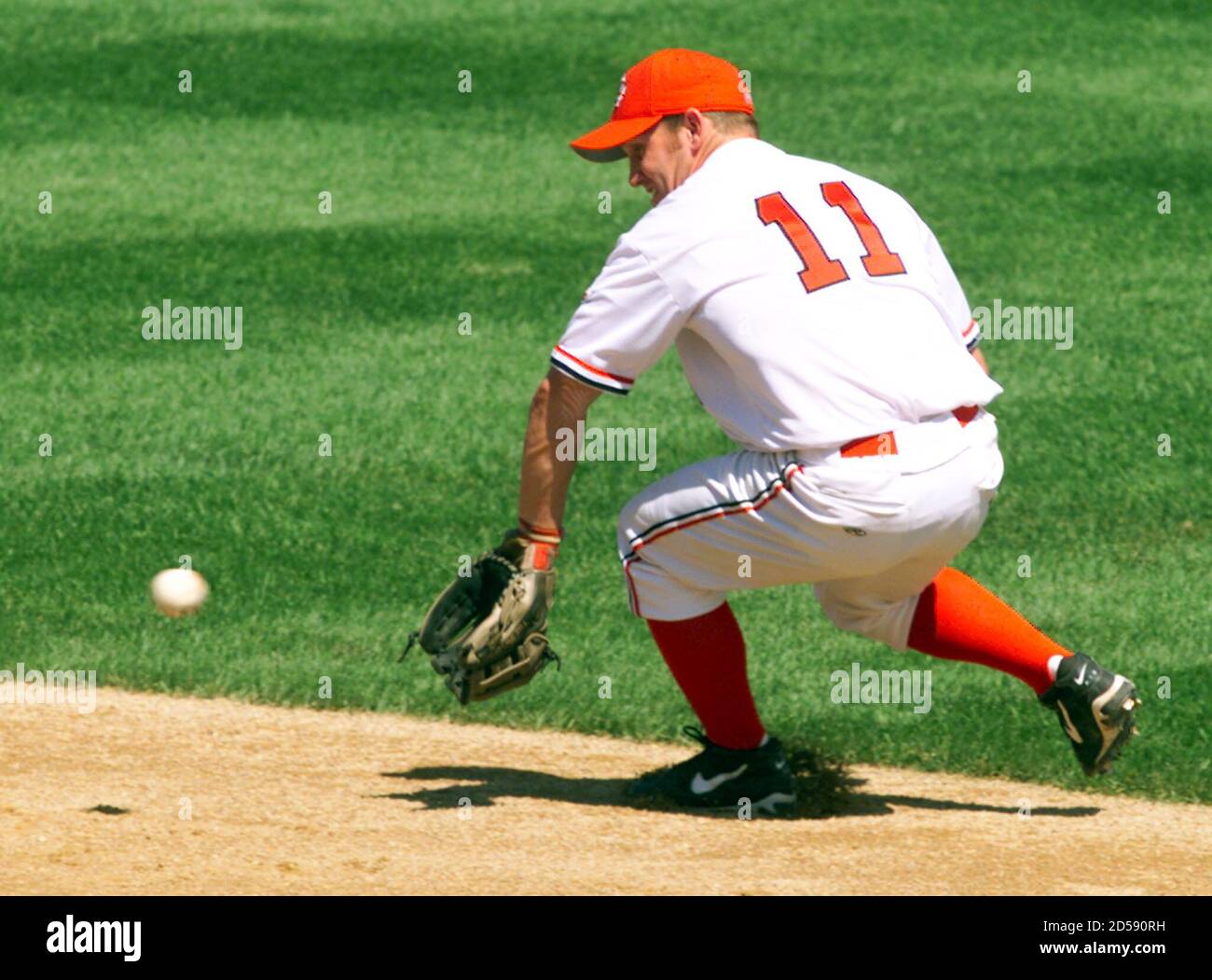 Second baseman Stubby Clapp of Canada makes a back-handed play for the  final out of the second inning against Brazil, during their opening-round baseball  game at the Pan American Games in Winnipeg,