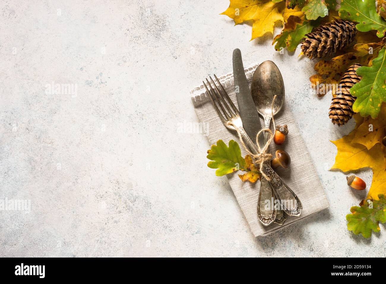 Autumn table setting top view at white table. Stock Photo