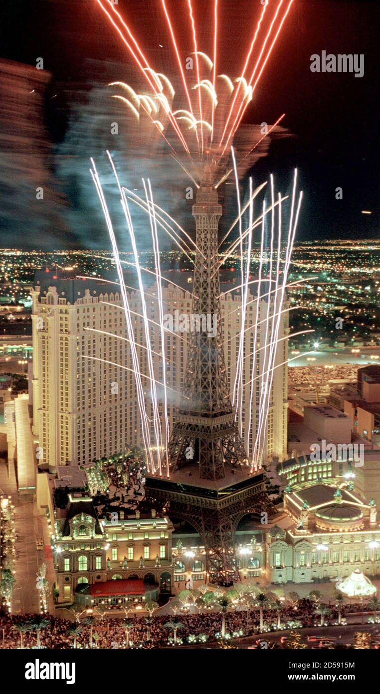 Fireworks erupt from the Paris Las Vegas mega-resort during its grand opening as seen from the neighbouring Bellagio Hotel and Casino belltower September 1 in Las Vegas. The $800 million French-themed resort, complete with a 50-story replica of the Eiffel Tower, is a project of Park Place Entertainment Corp. and includes an 85,000 sq. ft. casino, 130,000 sq. ft. of convention and meeting space, a European health spa and 31,500 sq. ft. of retail space. Park Place Entertainment owns Bally's, the Flamingo Hilton and the Las Vegas Hilton.The company is also in the process of buying Caesars Palace  Stock Photo