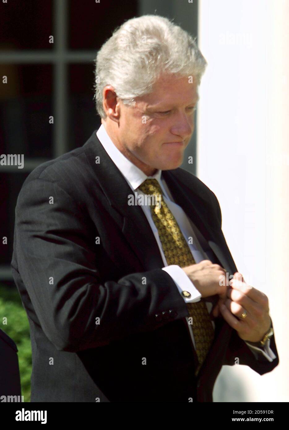 U.S. President Bill Clinton reaches for his pen as he prepares to veto the Republican backed $792 billion tax cut plan, setting the stage for an autumn budget showdown and giving both parties a campaign issue for the 2000 elections, September 23. Clinton said the bill 'would turn us back to the failed policies of the past.  WM/HB Stock Photo