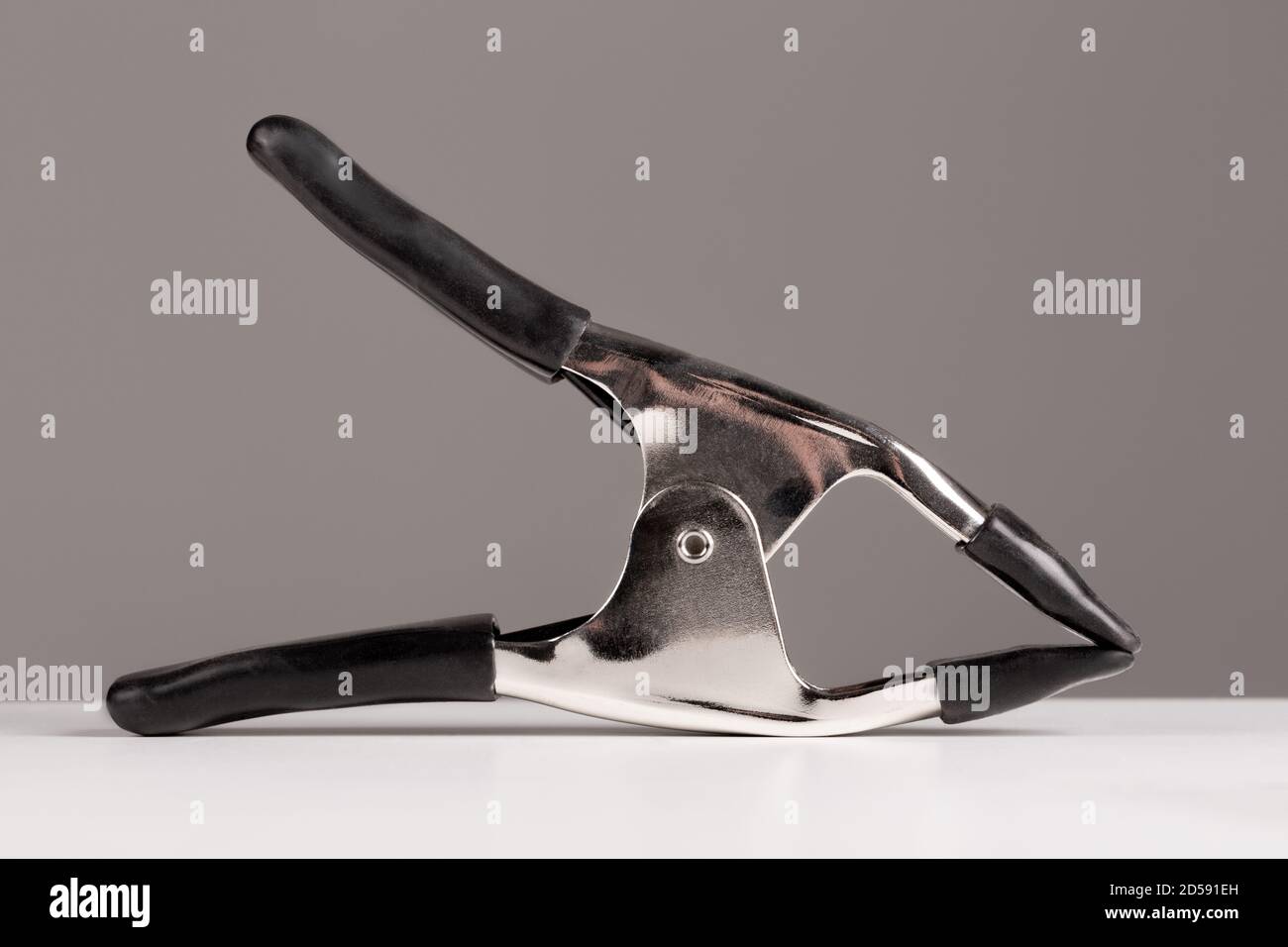 Spring clamp useful for gripping many things, particularly in a photography studio. Stock Photo