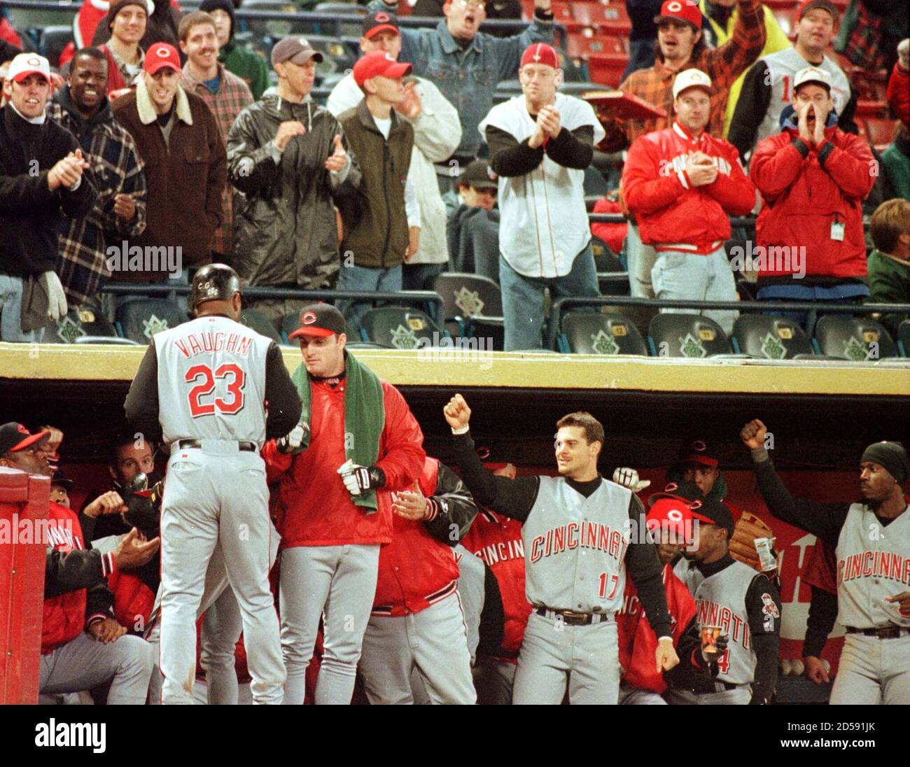 Cincinnati Reds' slugger Greg Vaughn (23) is greeted by players and fans after hitting a three-run home run off Milwaukee Brewers pitcher Cal Elred in the third inning at Milwaukee County Stadium October 3.  AF/SV Stock Photo