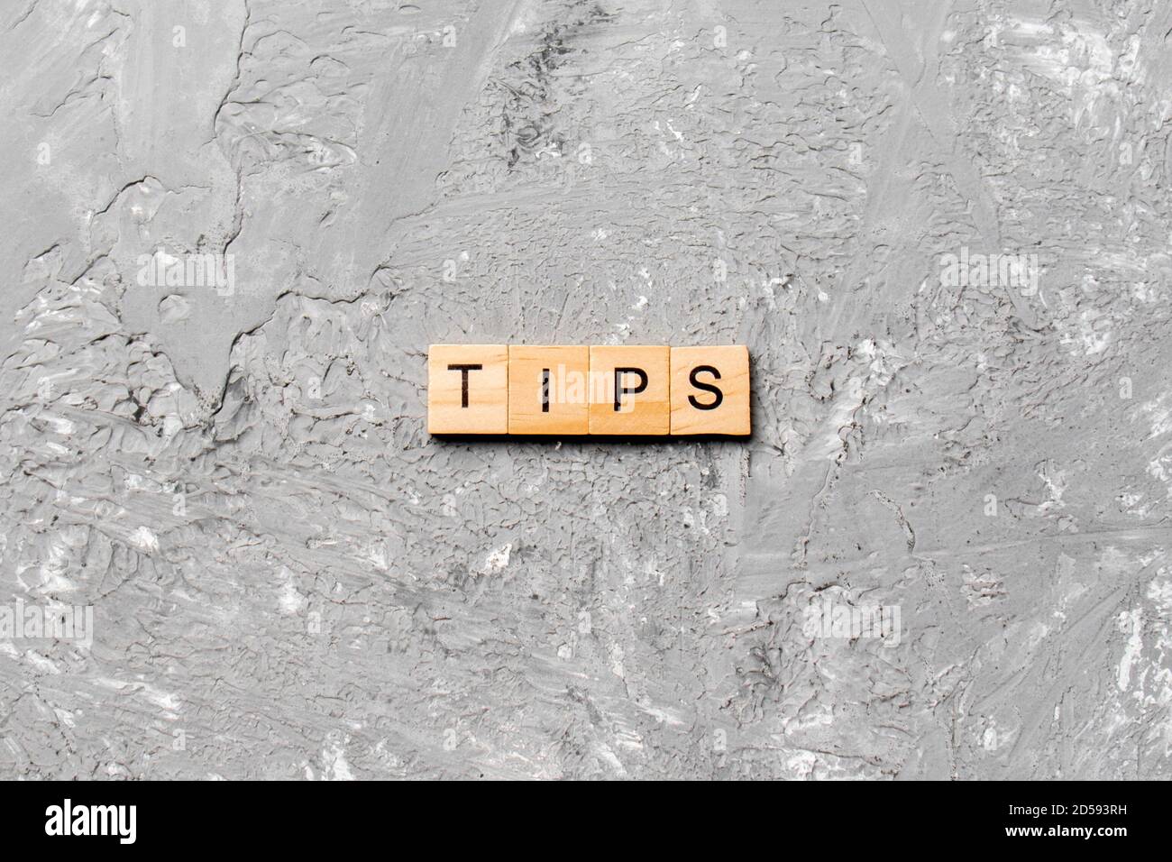 tips word written on wood block. tips text on table, concept Stock ...
