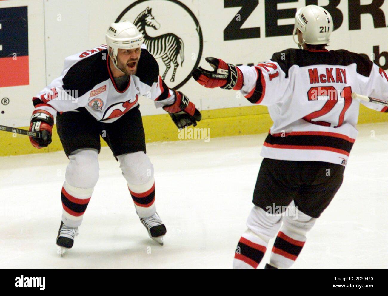 New Jersey Devils defenseman Ken Daneyko (L) celebrates with his teammate  Randy McKay after Daneyko scored his first goal of the playoffs in the  second period Game 1 of the 2000 Stanley