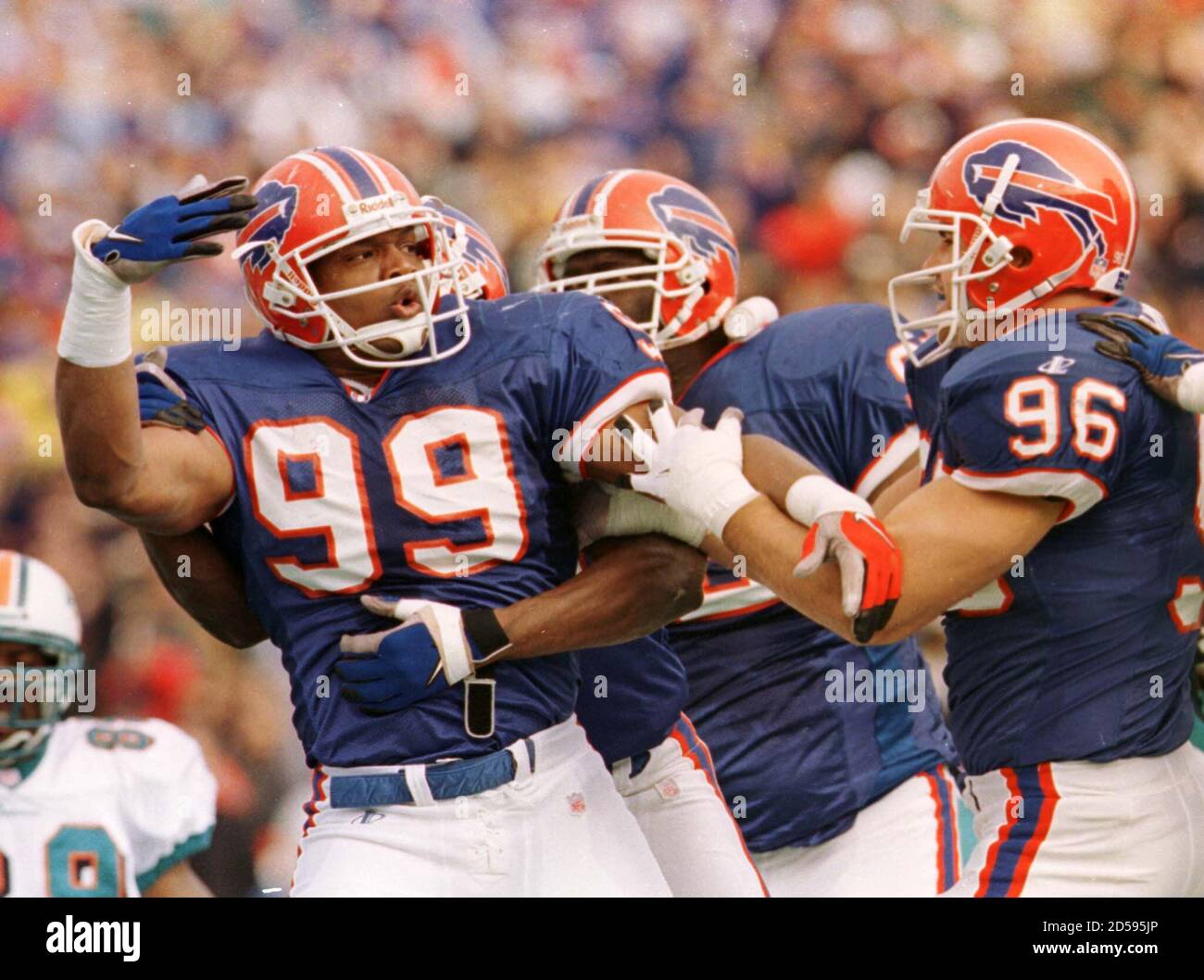 Buffalo Bills defensive players celebrate a second quarter play that  stopped the Miami Dolphins on a fourth down gamble November 1. Buffalo went  on to win 30-24 at Bills Stadium in Orchard