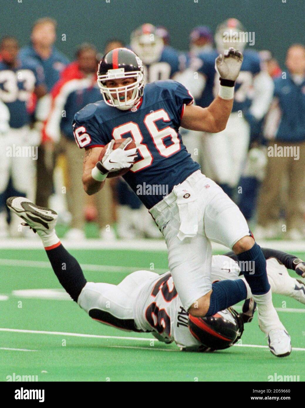 new-york-giants-wide-receiver-joe-jerevicius-36-makes-a-23-yard-catch-for-a-first-down-from-giants-quarterback-kent-graham-past-denver-broncos-defender-tito-paul-on-ground-during-the-second-quarter-of-their-game-at-giants-stadium-in-east-rutherford-new-jersey-december-13-the-giants-scored-a-touchdown-on-the-drive-four-plays-later-msljmclh-2D59660.jpg