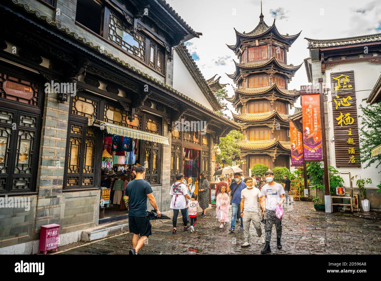 Kunming China , 3 October 2020 : Alley with old buildings and people at Yunnan Ethnic Village in Kunming Yunnan China Stock Photo