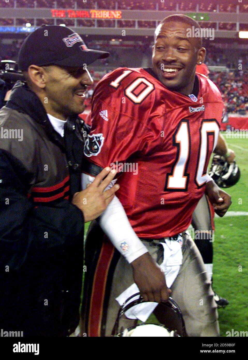 Tampa Bay Buccaneers' rookie quarterback Shaun King (R) celebrates with  head coach Tony Dungy (L) after the Bucs secured a playoff spot with a  29-10 win over the Green Bay Packers, December