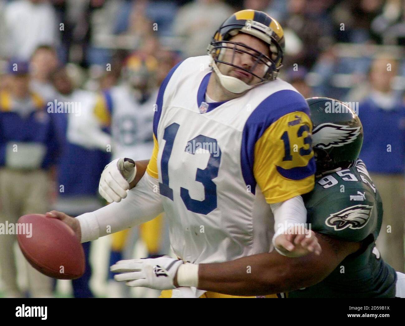 St Louis Rams quarterback Kurt Warner (L) is sacked for an eight yard  lossby the Eagles Tyrone Williams (R) during the third quarter in  Philadelphia, January 2. The Eagles surprised the playoff