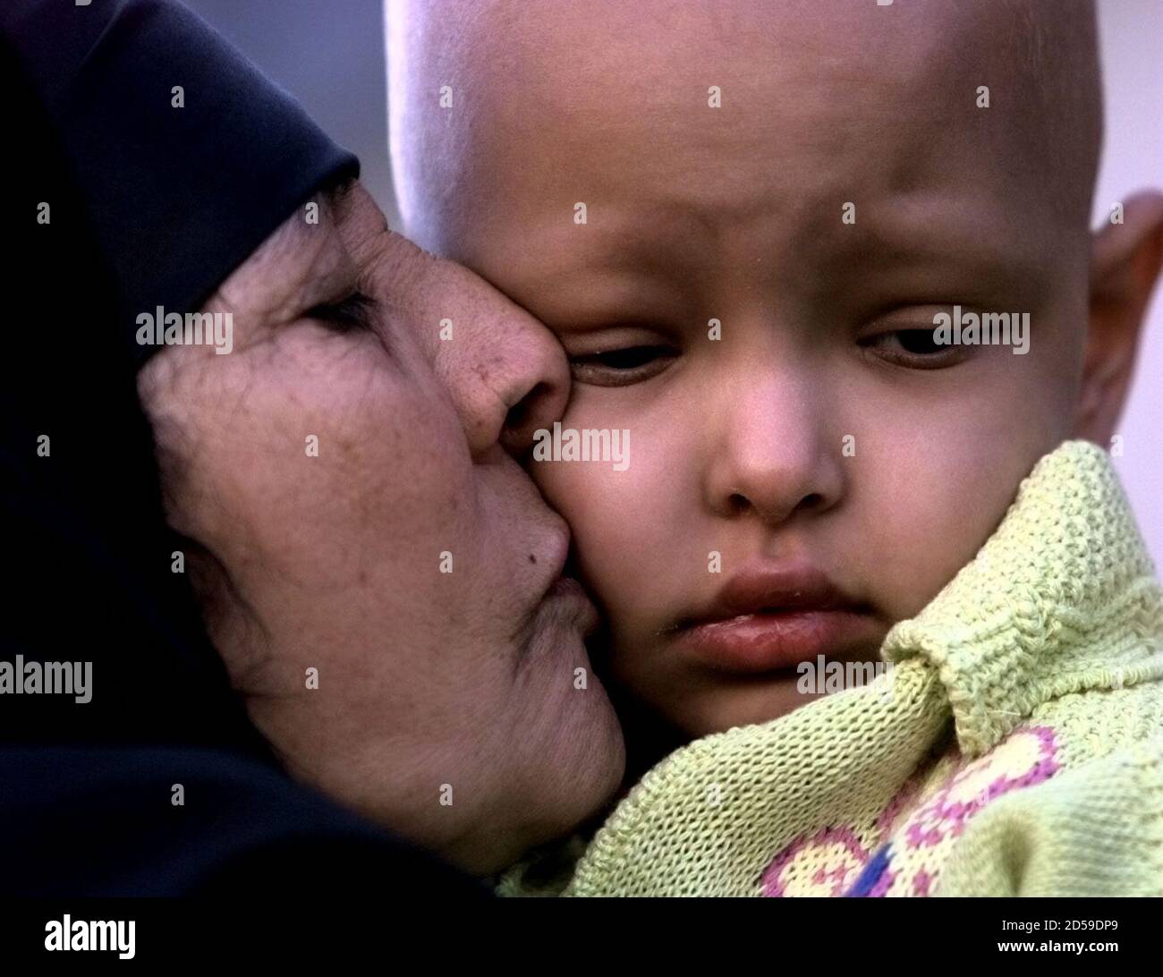 Four-year-old Mariam Hamza gets a kiss from her Grandmother before  departing from Yorkhill Hospital in Glasgow on her way back to Iraq October  12. Mariam was brought to this country by local