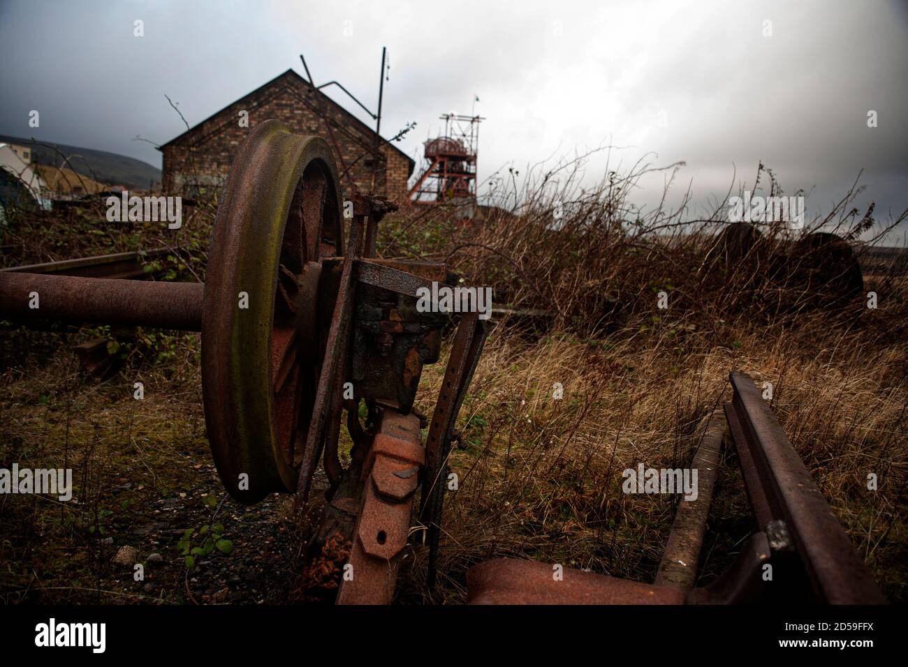 Iron machine parts discarded at Big Pit former coal mine at UNESCO World Heritage Site, Blaenavon Industrial Landscape, South Wales, United Kingdom Stock Photo