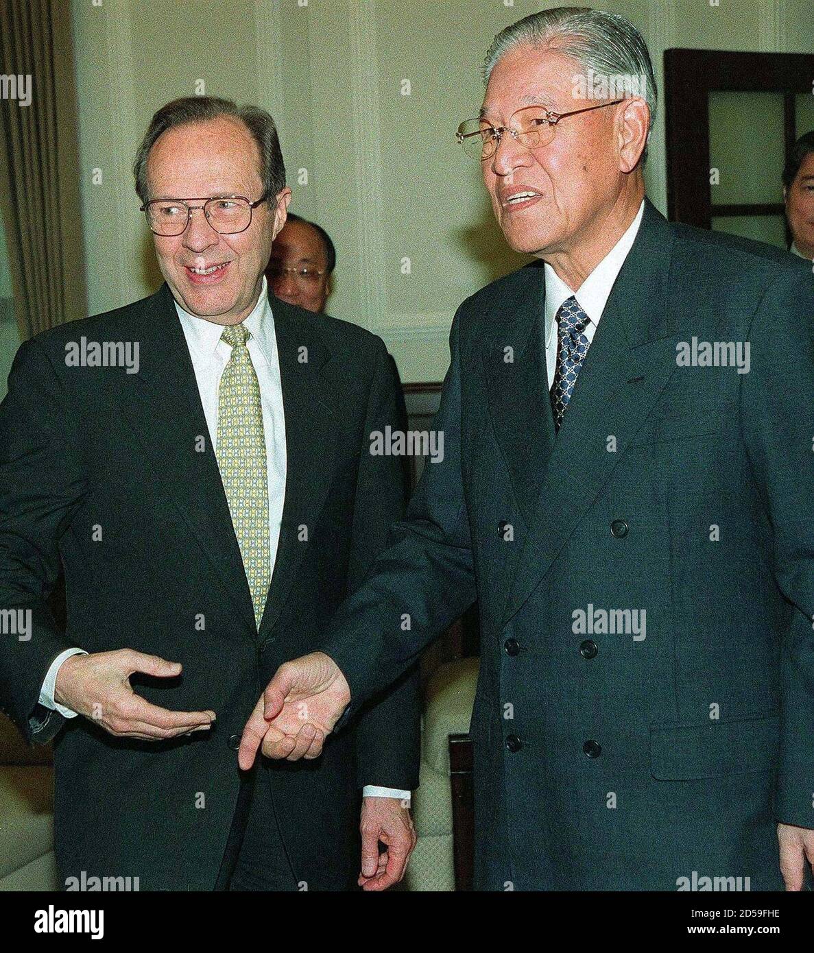 Taiwanese President Lee Teng-hui (R) meets with visiting former US defense  secretary William Perry March 8 in Taipei. Perry, leading a five-member  delegation, arrived in Taipei Sunday for a two-day trip after