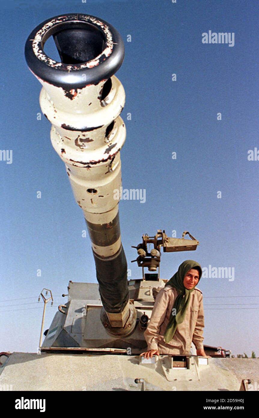 A Mujahideen woman fighter gets out of a tank June 11. Iraq said on Friday that Iran had fired three long-range misiles at an Iranian exile opposition group based inside Iraq. The official Iraqi news agency said that the camp belonged to Iranian opposition group Mujahideen Khalq. Around 50,000 NLA fighters are based in 17 military camps along the Iranian border. Stock Photo