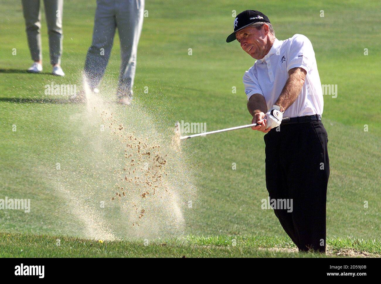 South African former golf star Gary Player hits the ball in a bunker as he  attends the Pro-celebrity golf tournament at the Monte Carlo golf club  September11. Professional golfers and celebrities participated