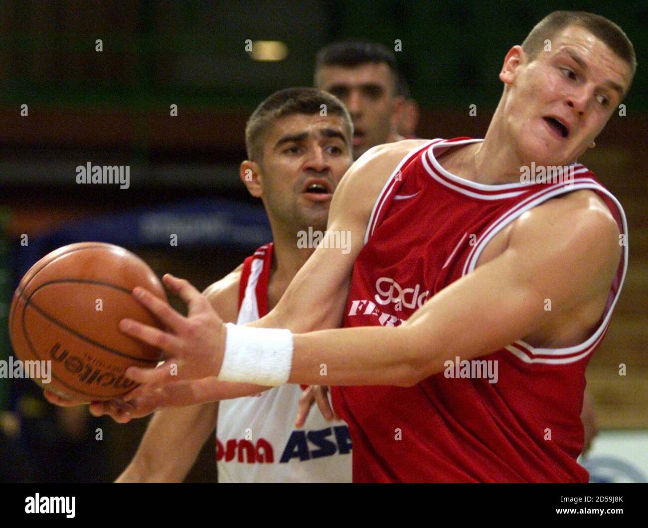 Djordje Cekovski of the Macedonian champions Rabotnicki (R) takes posession  of the ball in front of Kurtagic Damir (L) of KK Bosna Sarajevo during  their group D basketball match at the Euro