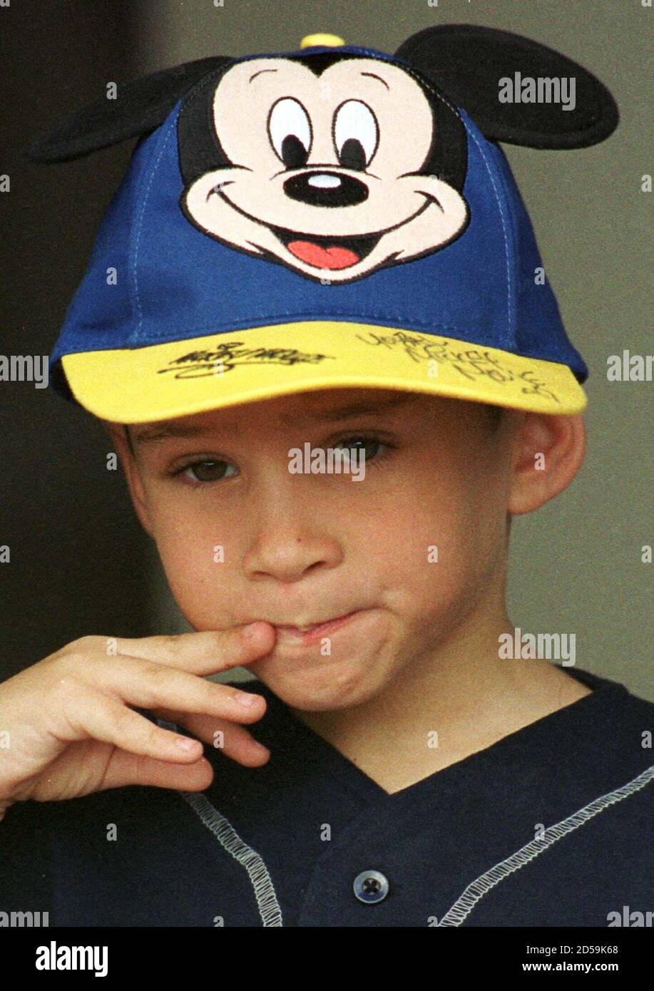 Wearing an autographed Mickey Mouse hat 