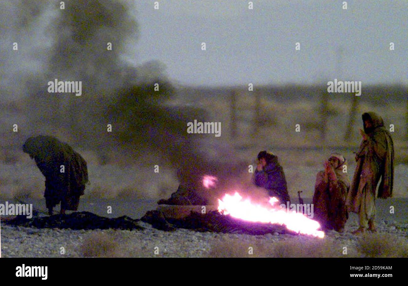 Taleban Militiamen Guarding The Hijacked Indian Airliner Warm Themselves Around A Fire At Kandahar Airport In Southern Afghanistan Early December 31 Hostages Spent The Coldest Of Their Seven Nights In Captivity After