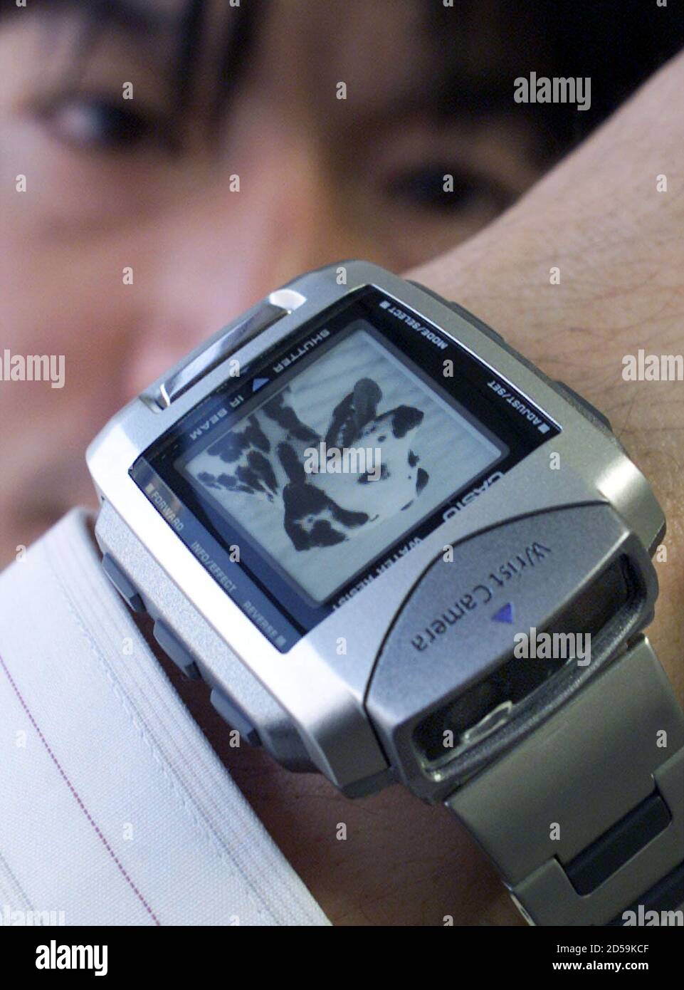 Casio Computer Company's Akira Watanabe shows off the "world's first wrist-type  wearable digital camera WQV-1" which is unveiled in Tokyo January 6. The  display screen of the wrist camera is a 120