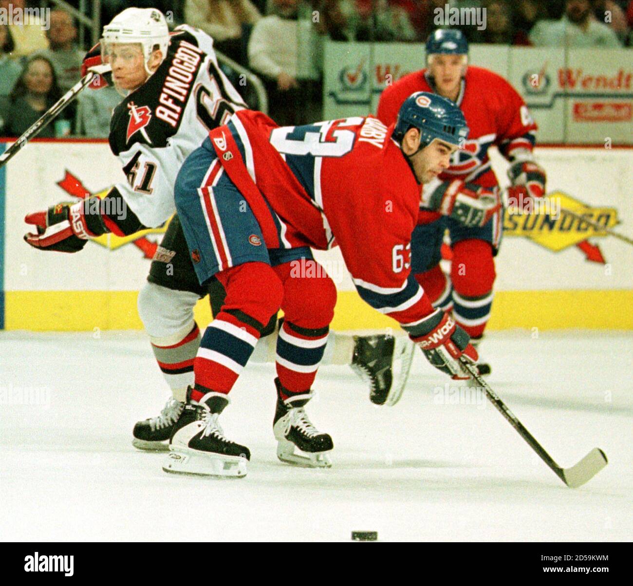 Montreal Canadiens Center Criag Darby R Attempts A Hip Check On Buffalo Sabres Right Winger Maxim Afinogenov L In The First Period March 10 Bm Stock Photo Alamy