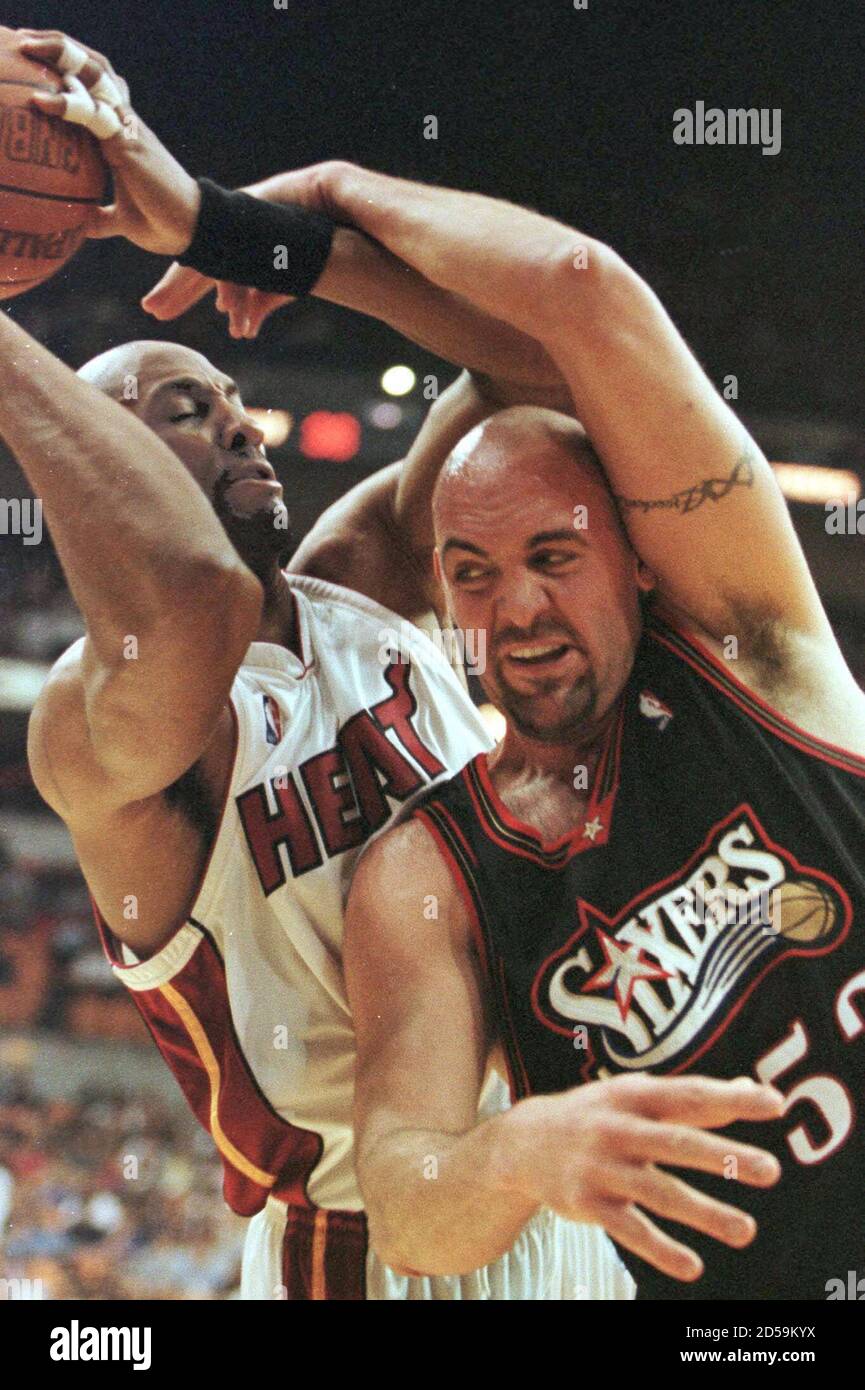 Miami Heat Center Alonzo Mourning (L) is fouled by Philadelphia 76ers  center Matt Geiger (R) March 16 in first period NBA action. MS Stock Photo  - Alamy