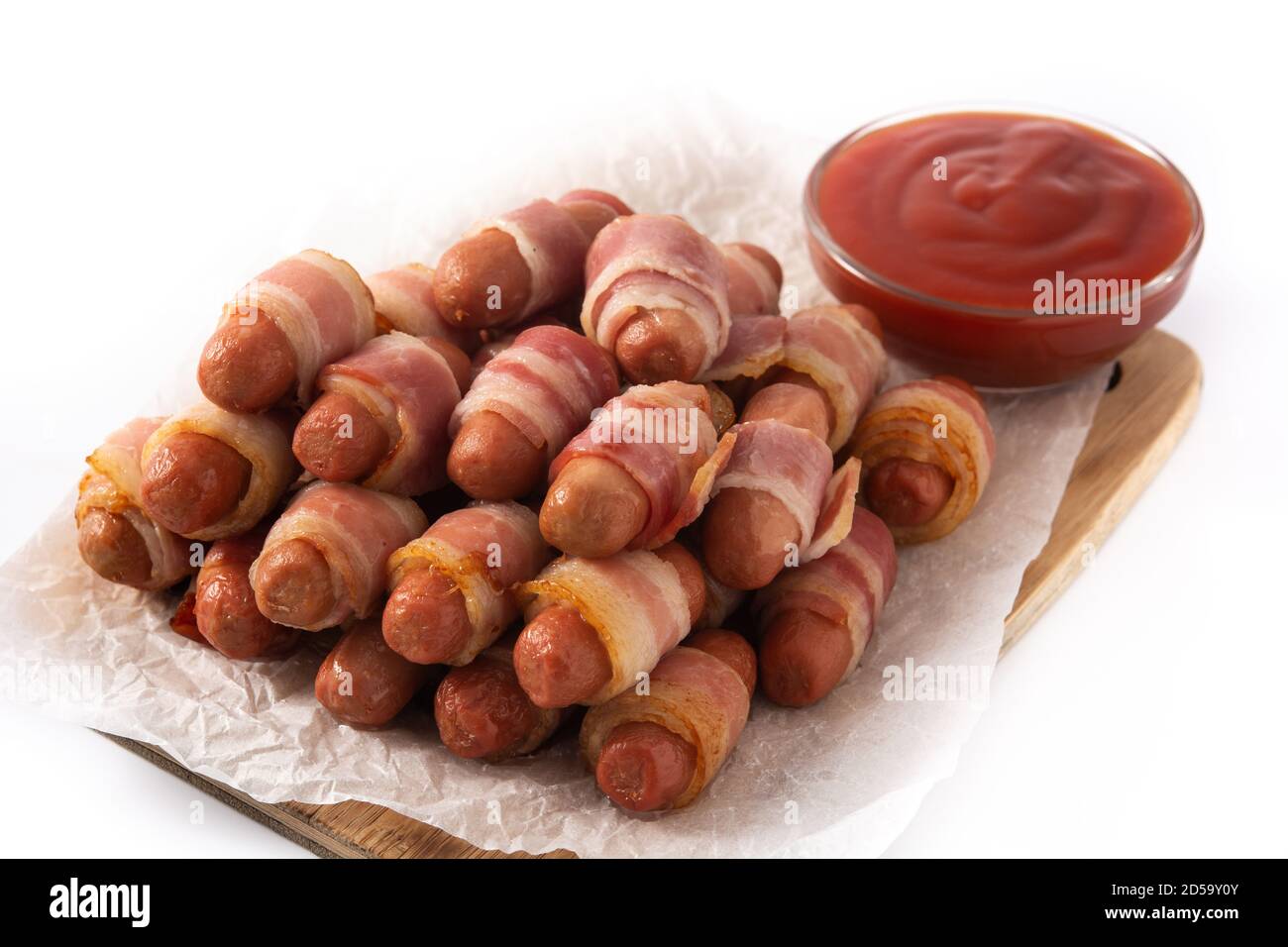 Pig in blankets. Sausages wrapped in smoked bacon isolated on white background Stock Photo Alamy