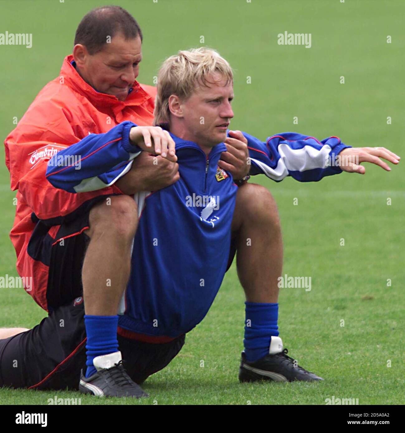 Czech team Physio Ladislav Krabec (L) stretches midfielder Radek Bejbl at  the end of the closed training session June 14. The Czech Republic are  training for their second group D match of