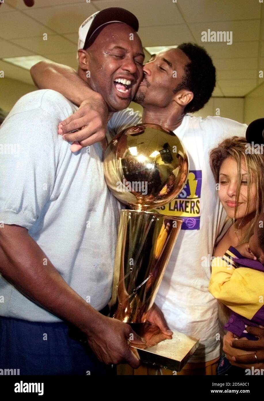 kobe bryant holding trophy