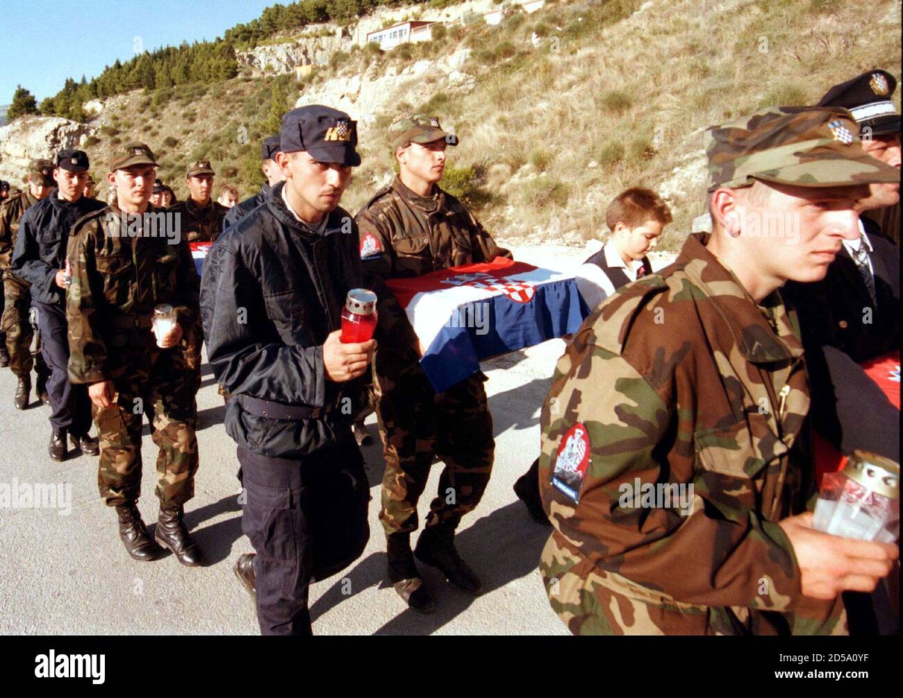 croatian-soldiers-carry-the-remains-of-some-100-soldiers-from-croatias-world-war-ii-fascist-army-october-27-during-a-reburial-ceremony-the-remains-were-reburied-in-omis-alongside-anti-nazi-partisan-fighters-despite-jewish-outrage-2D5A0YF.jpg