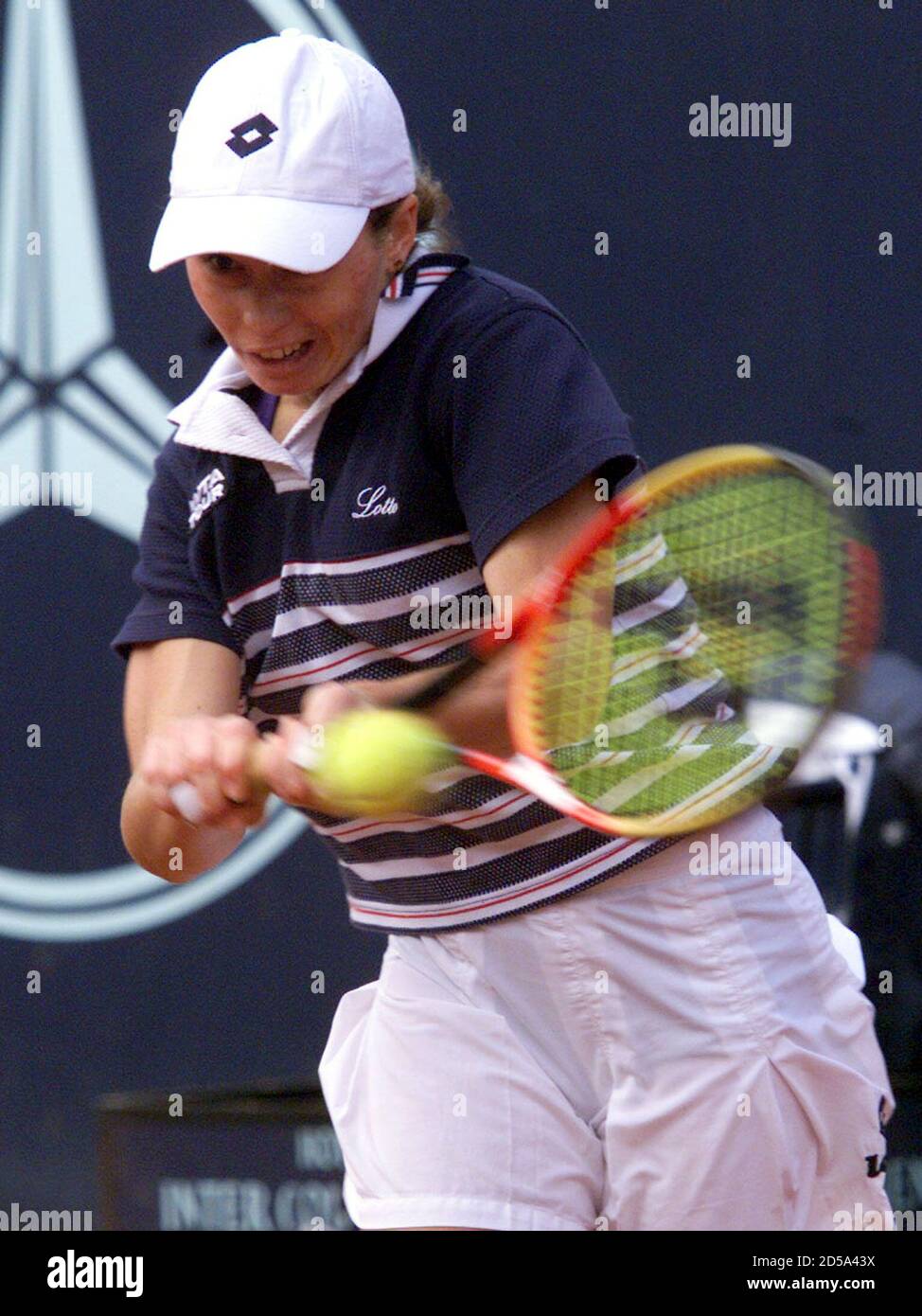 Cara Black of Zimbabwe returns the ball during her match against German tennis  player Steffi Graf