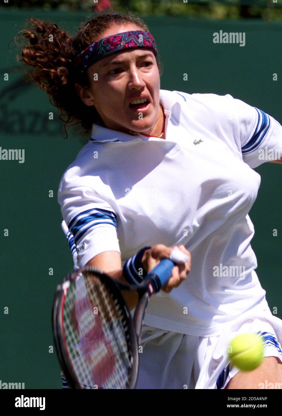 France's Sandrine Testud plays a return to Tamarine Tanasugarn of Thailand  during their third round match at the Wimbledon Tennis Championships June  25. Testud is seed number 13 in the competition. KD