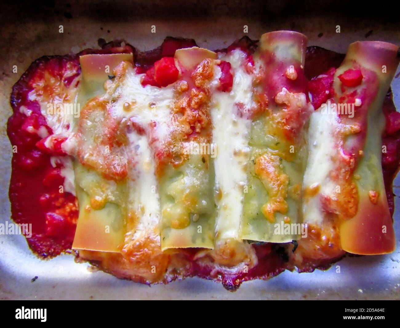 Freshly Cooked Cannelloni Pasta with Spinach, Chopped Tomatoes and