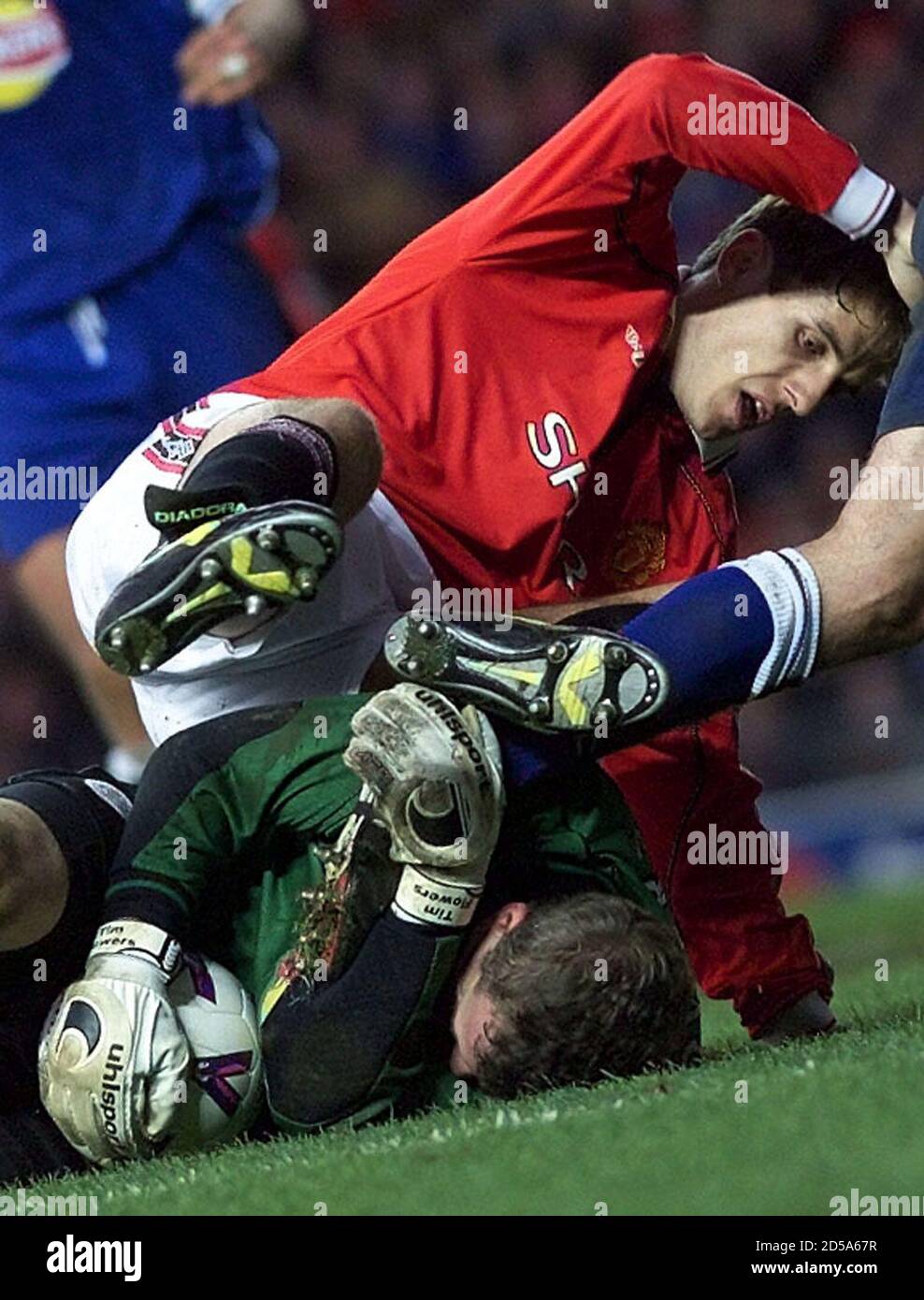 Manchester United's Phil Neville fights for the ball with Leicester City goalkeeper Tim Flowers after an attempt on goal during the FA Carling Premiership game at Old Trafford November 6. ManchesterUnited went on to win 2-0.  DC Stock Photo