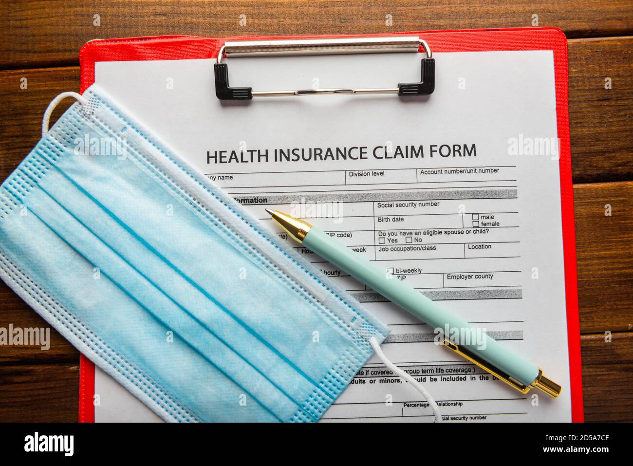 Health insurance claim form with stethoscope , pen and surgical mask Stock Photo