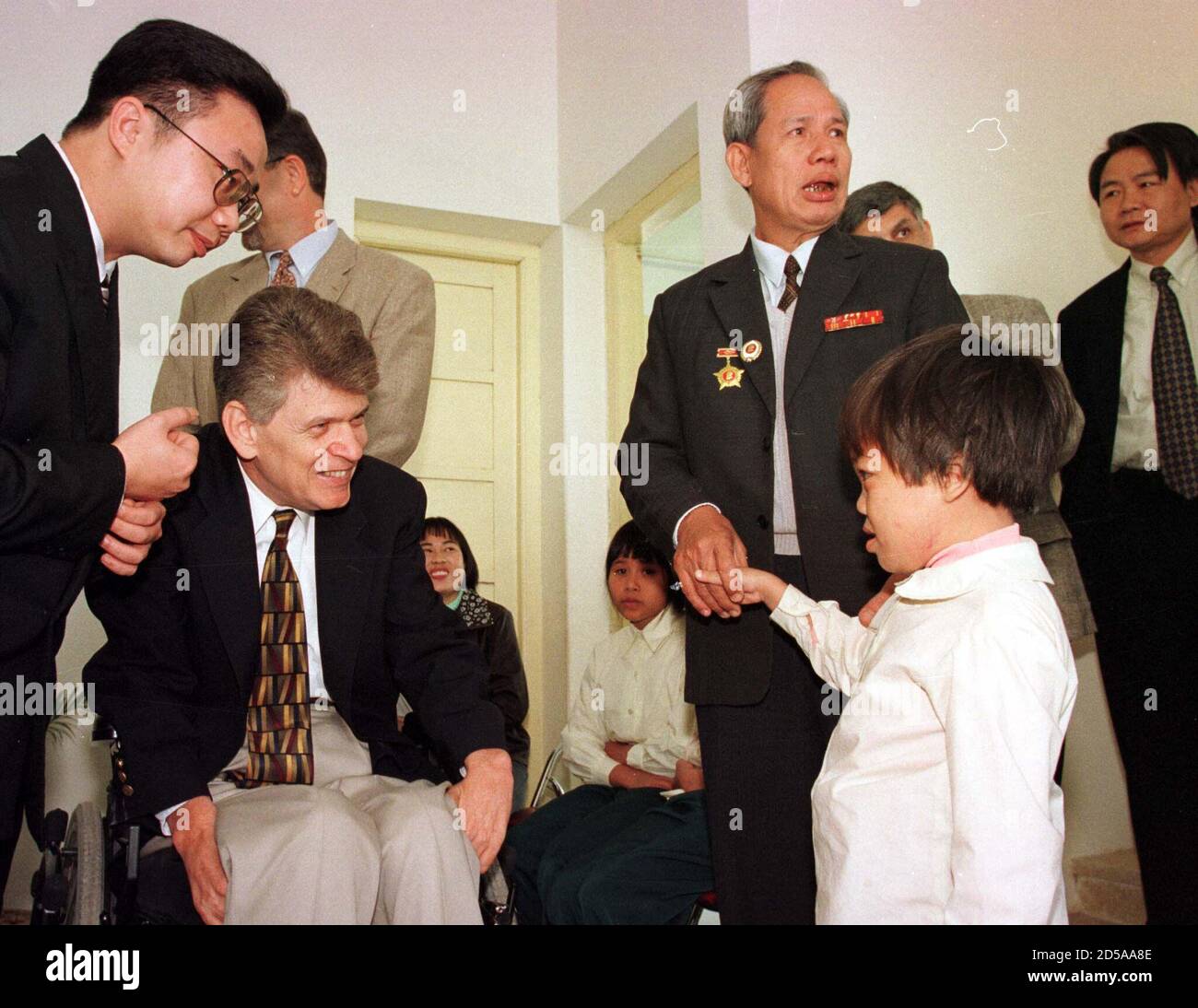 A U S Vietnam War Veteran Meets A Vietnamese Child Suffering Birth Defects Due To Her Parent S Exposure To Agent Orange Tom Cory National Vice President Of The Vietnam Veterans Of America Inc In