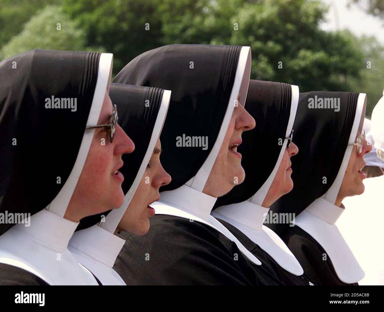 Nuns Pray During A Mass Held By Pope John Paul II In The North eastern 