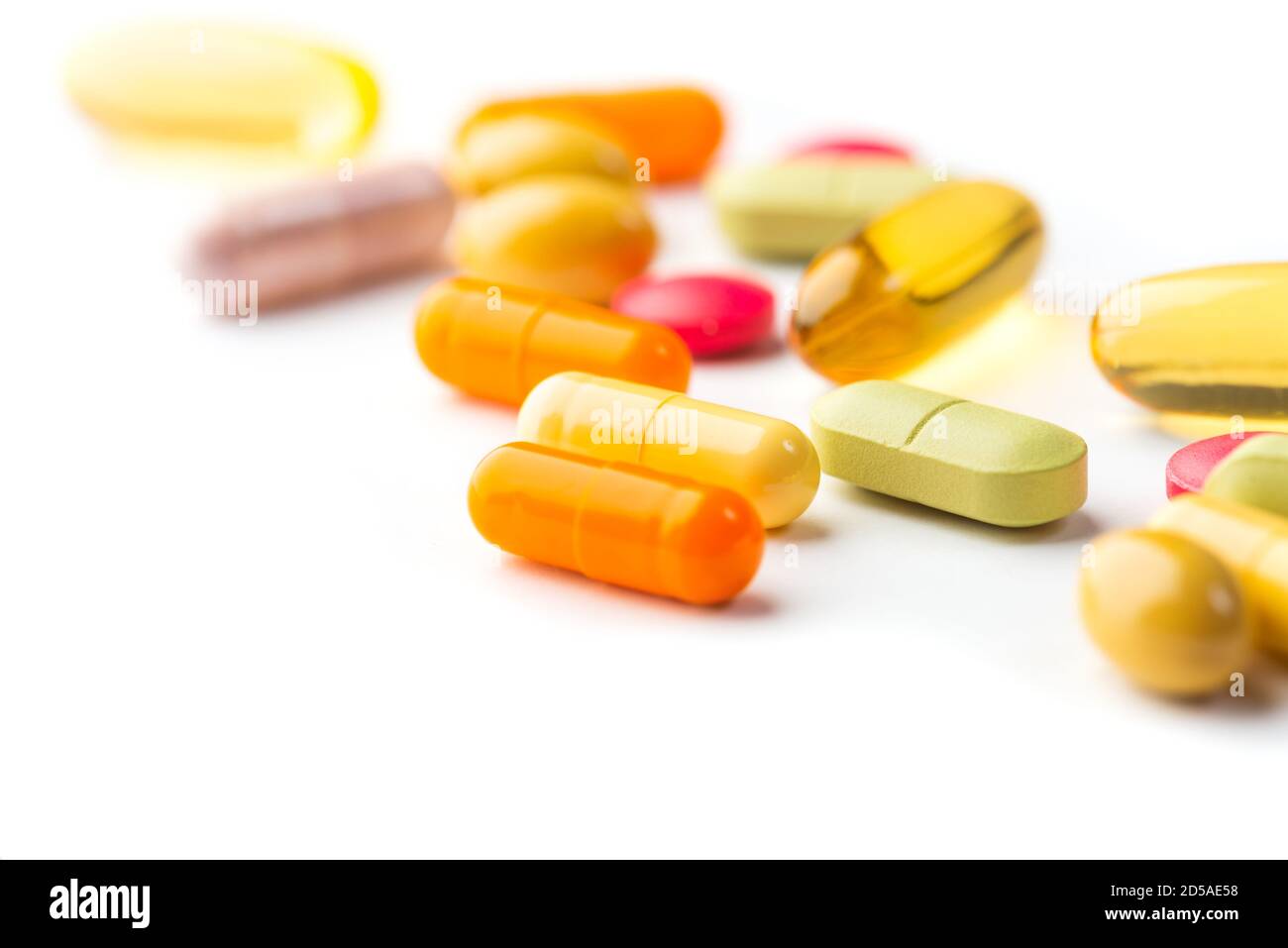 Selective focus on colorful medication and pills on white background Stock Photo