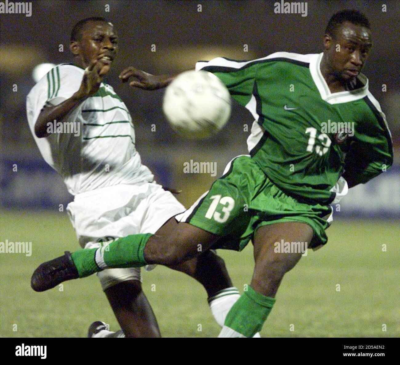 Nigerian Player Tijani Babangida R Fights For The Ball With Ousmane