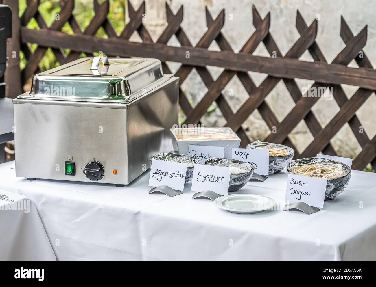 Large barbecue grill and smoker setup with sauces grilling meat bbq