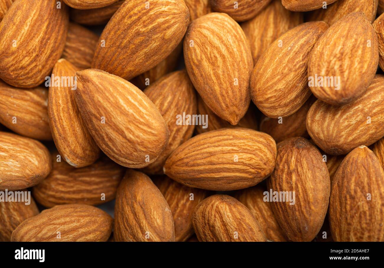 Background of big peeled almonds Stock Photo