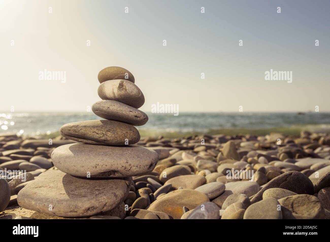 Stack stones on the coast of the sea in the nature. Stock Photo