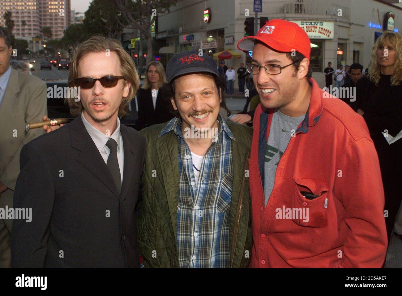 Actor David Spade (L), star of the new comedy film "Lost & Found," poses  with friends, comedic actors Rob Schneider (C) and Adam Sandler at the  film's premiere on April 21 in