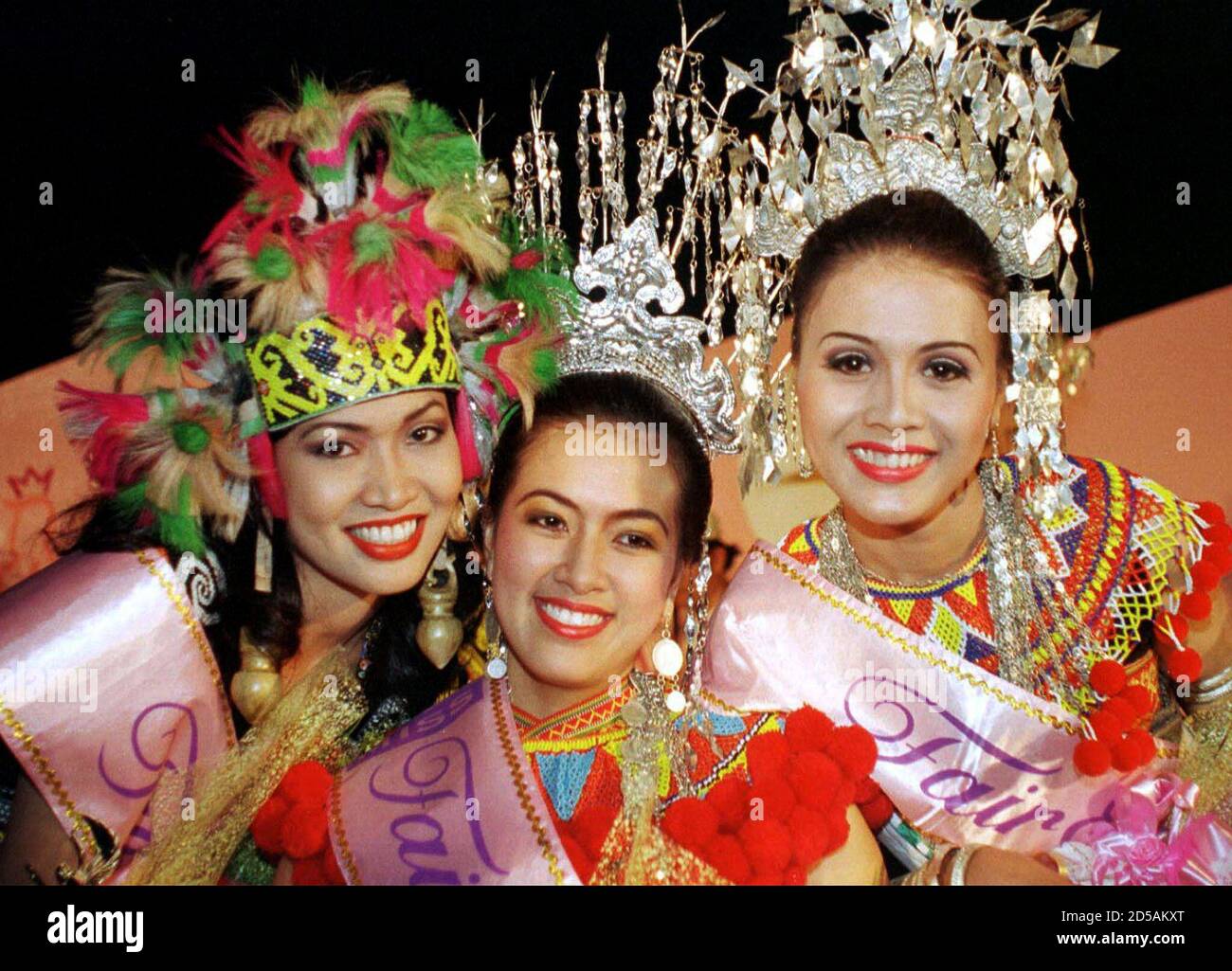 Eighteen-year-old Rowena Awa Ngumbang (C), winner of Miss Fair and Lovely Ethnic Beauty contest, poses with first runner-up Sophia James (R), 24, and second runner-up Duling Musit, 23, after the prize presentation at the Sarawak Cultural Village in Damai about 35 kilometers from Kuching, in the east Malaysian state of Sarawak May 22. Gawai Dayak festival, a thanksgiving for bountiful harvest is celebrated on June 1 every year by the Dayak community which formed almost half of Sarawak's 1.9 million population.  ZH/CC/ME Stock Photo