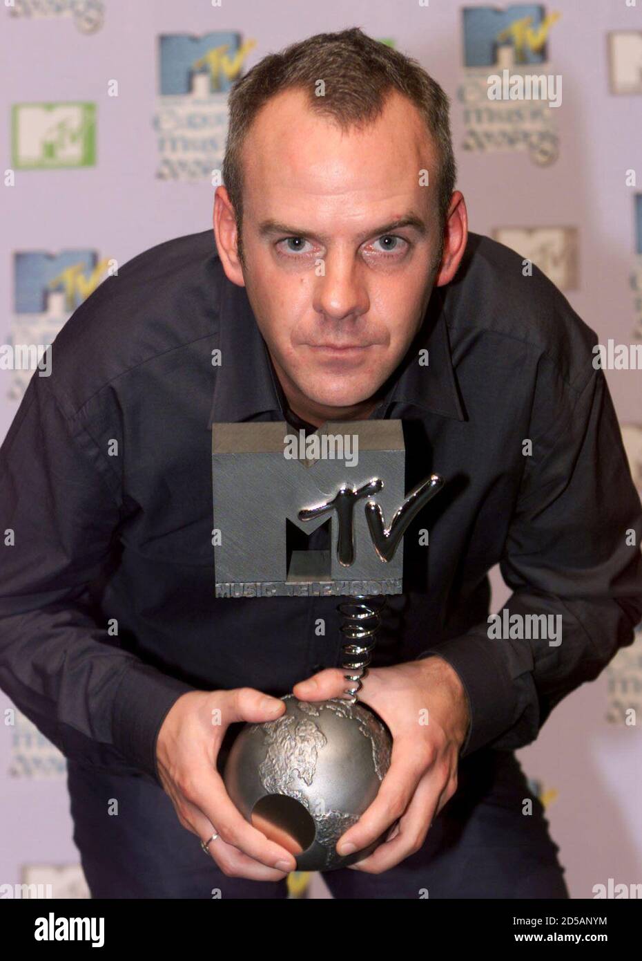Norman Cook, otherwise known as D.J. Fatboy Slim, poses with his award for best  Dance Act at the MTV Europe awards ceremony at Dublin's The Point on  November 11. The MTV awards