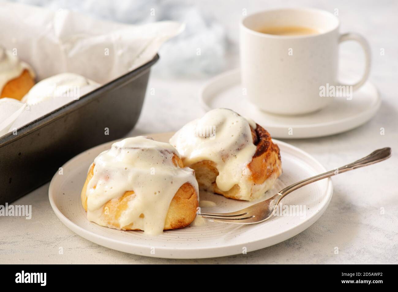 Homemade cinnamon buns with cream cheese icing Stock Photo Alamy