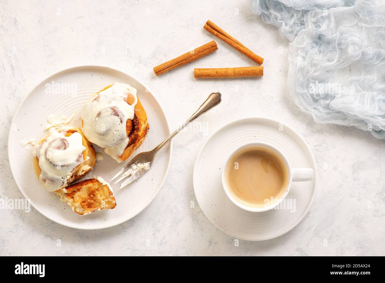 Homemade cinnamon buns with cream cheese icing. Stock Photo